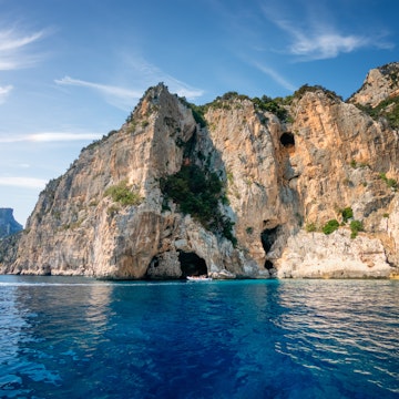 The coast of Baunei in the Gulf Of Orosei full of caves. Grotta del Fico on the cliffs of Gulf of Orosei.; Shutterstock ID 1829225672; your: Erin Lenczycki; gl: 65050; netsuite: Online Editorial; full: Destination update